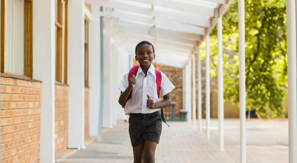 A schoolchild in a community supported by Katulya's grower network